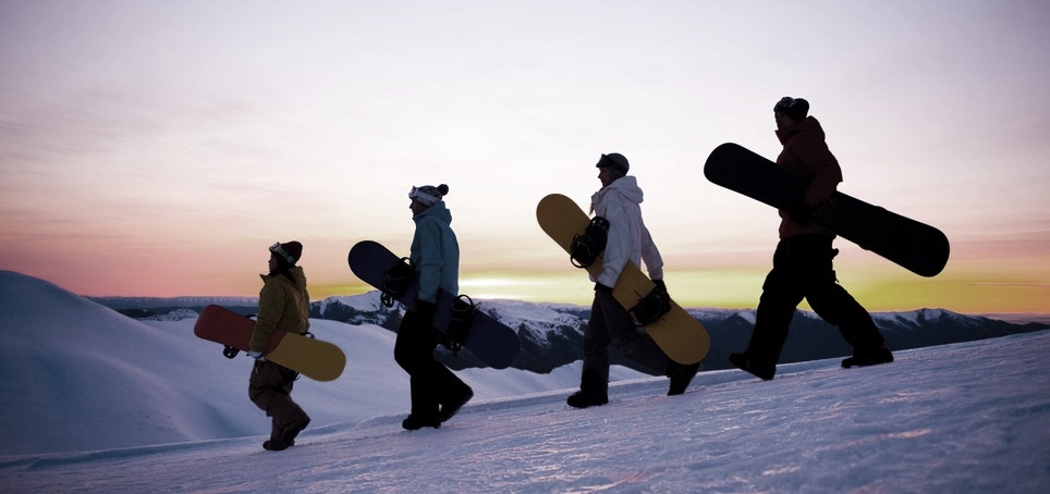 People on their way to snow boarding.